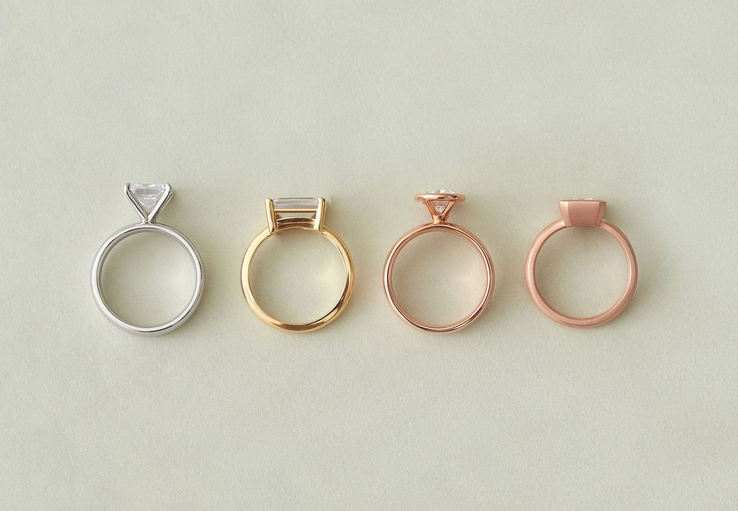 Comparison photo showing high and low-set engagement rings by Holden