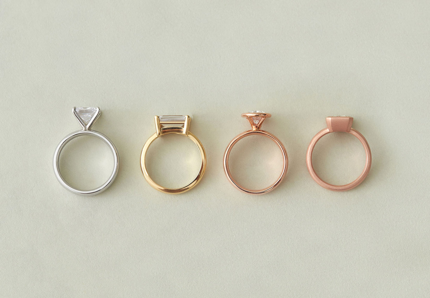 Comparison photo showing high and low-set engagement rings by Holden