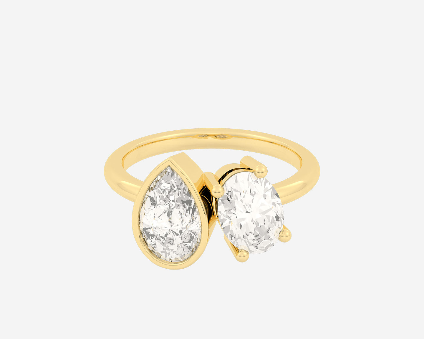 \ alt: Yellow gold toi et moi ring with pear bezel and oval prong diamond on classic 2mm band \ carat : 1.5 ct