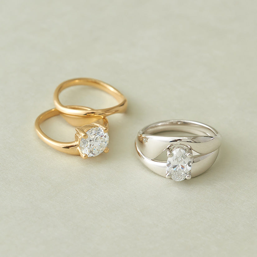 The Embrace Solitaire Set by Holden in yellow gold (left) and white gold (right)